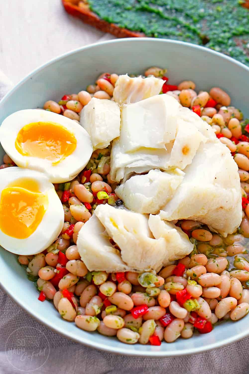 Kabeljau-Confit auf Bohnensalat mit Piso